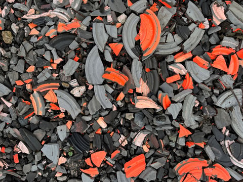 Broken clay pigeon targets on ground